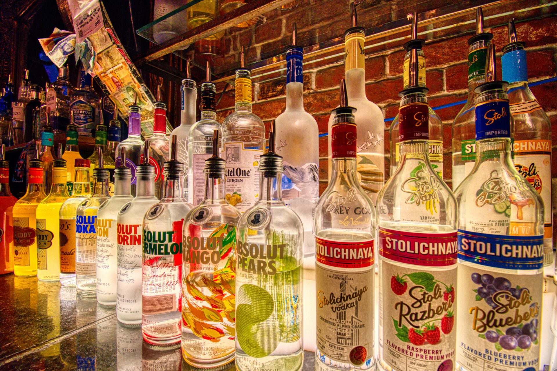 A bar with many different types of alcohol.