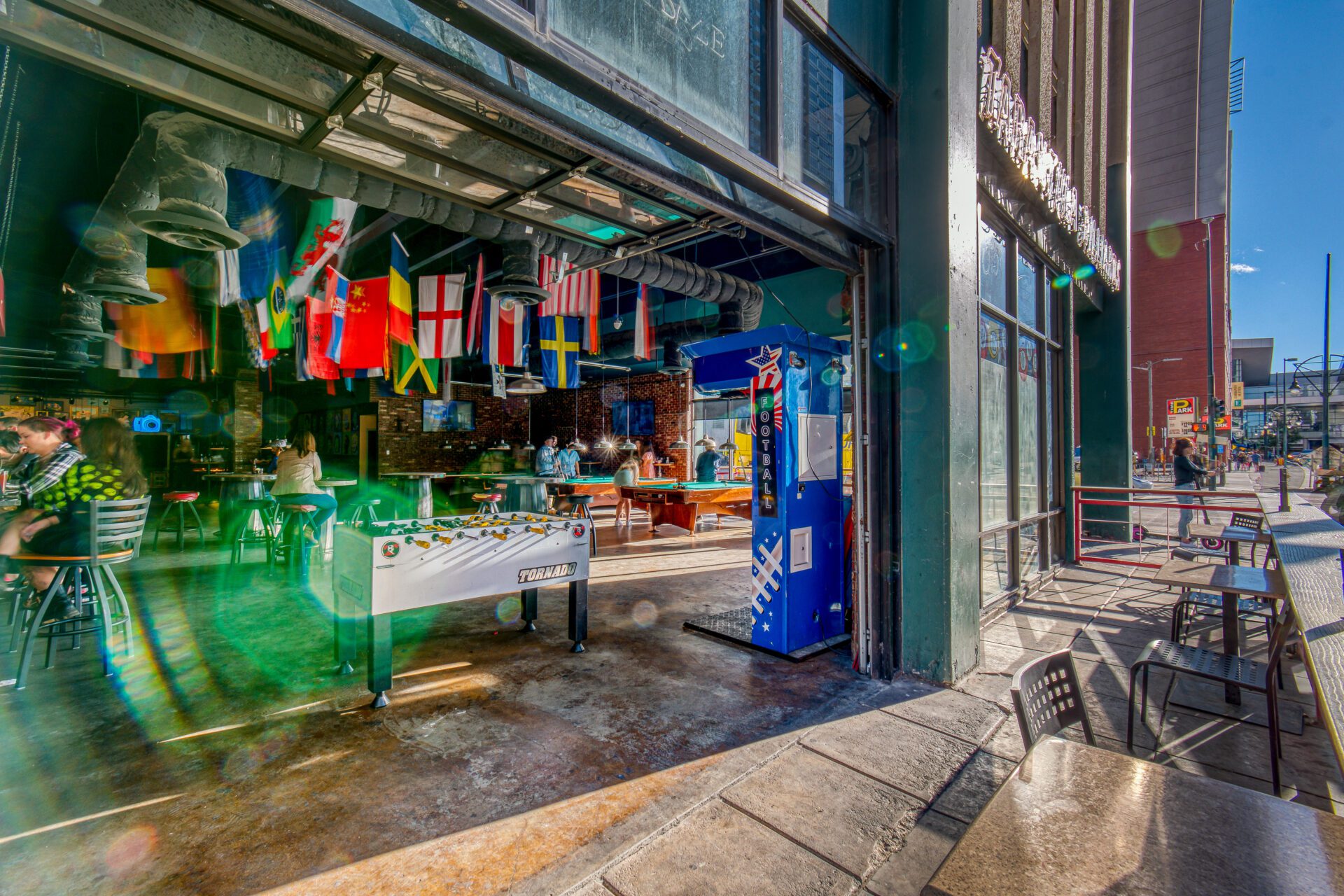 A street view of a table and chairs outside.